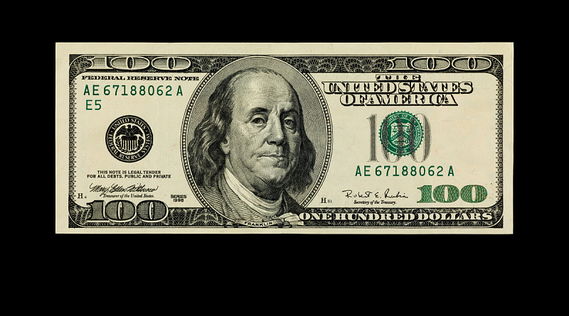 US 100 dollar bill on a black background